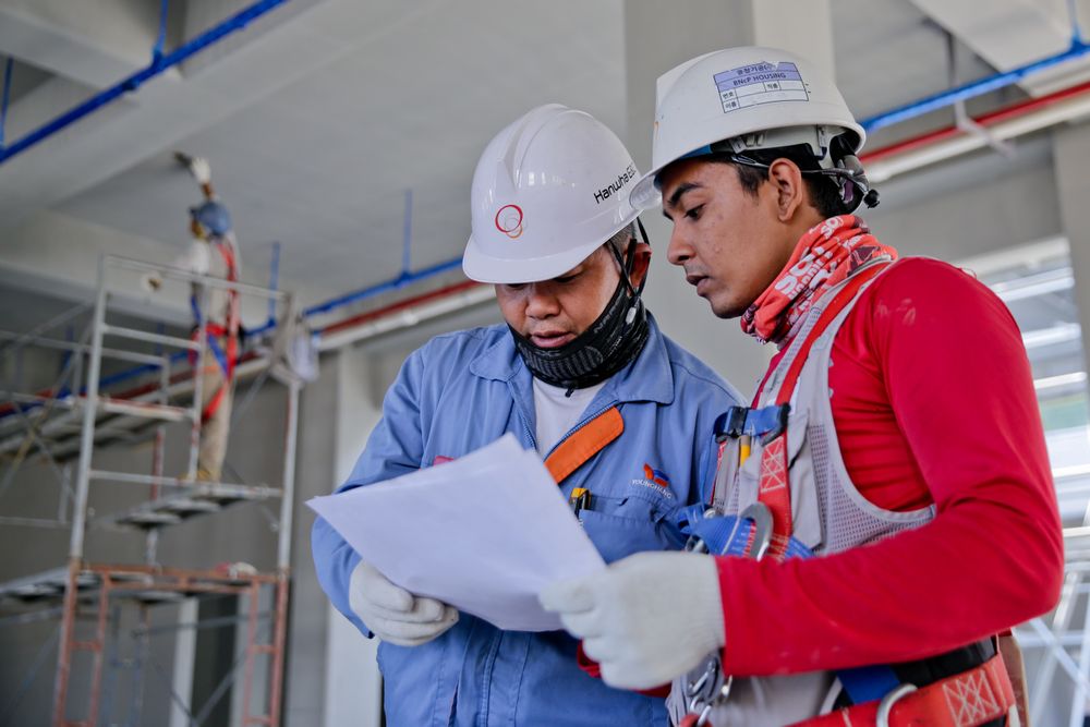 Construction team reviewing building plans