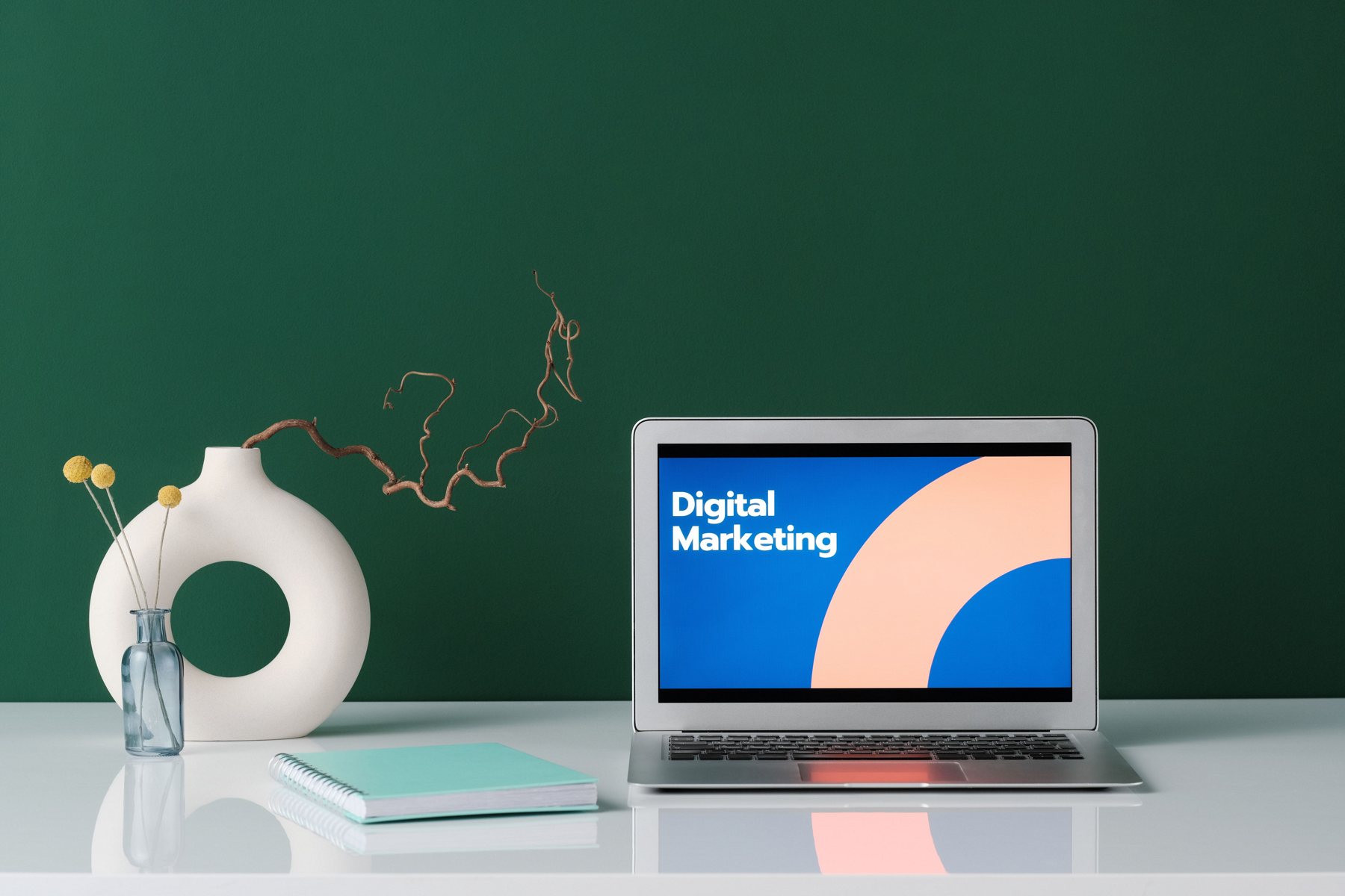 Laptop displaying digital marketing on a studio desk
